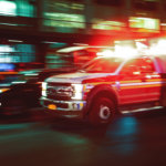 An emergency vehicle driving to the hospital.